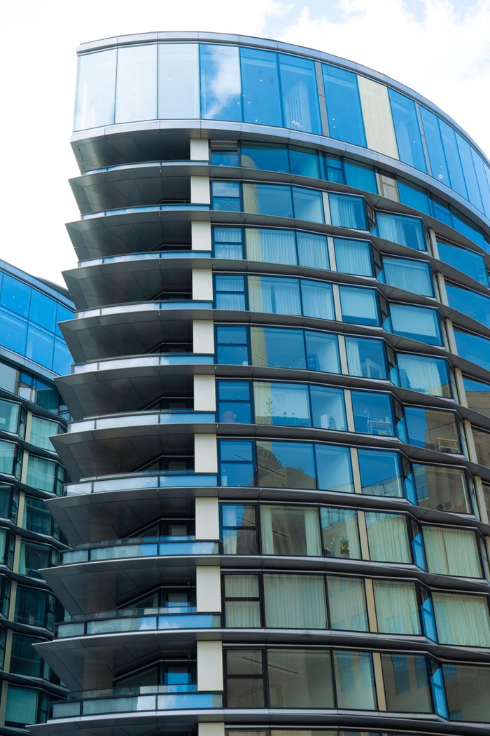 A striking glass facade of a contemporary urban building, highlighting modern architecture in London.
