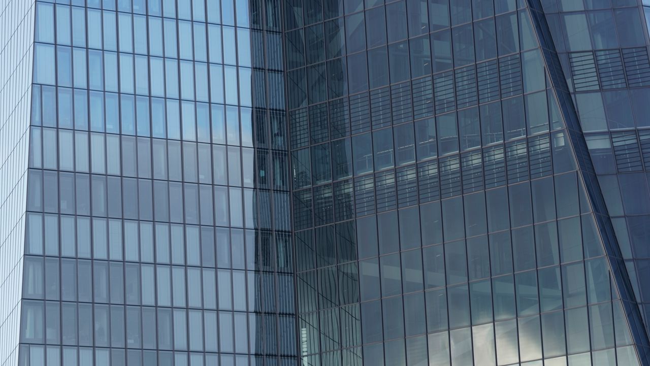 Close-up of a modern skyscraper facade showcasing contemporary glass architecture.